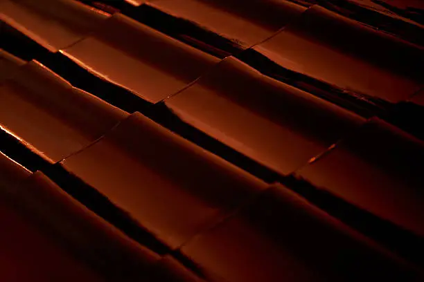 Abstract closeup metal profile roof-tile at sunset