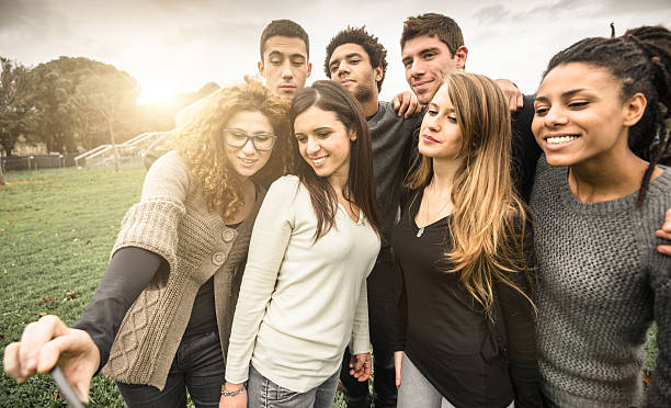 istock Group of college student laughing and doing a selfie 535535841