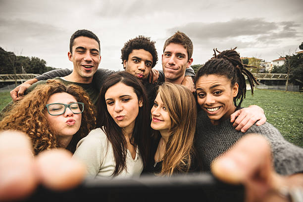istock Group of college student laughing and doing a selfie 535536107