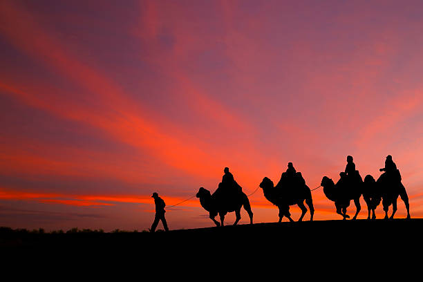 istock great sky and caravan travelers riding camels 535536143