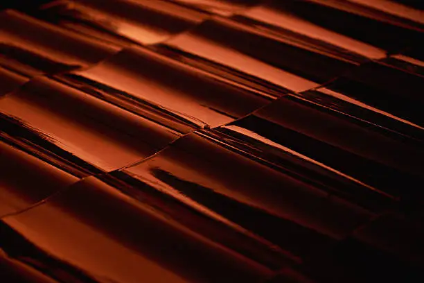 Abstract closeup metal profile roof-tile at sunset