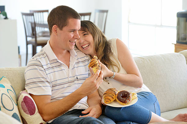 Young, relaxed couple with some pastries