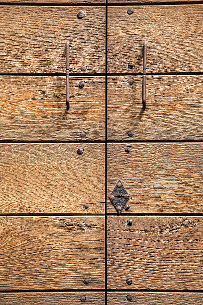 istock Wooden door with large iron nails 535542641