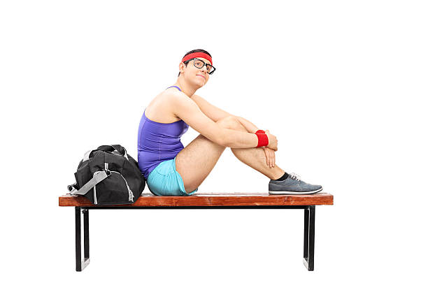 istock Pensive young sportsman sitting on a bench 535543239