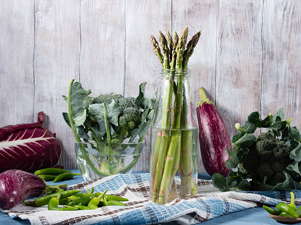 Green vegetables on wooden background