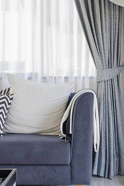 istock white pillow on blue sofa in modern living room 535553191