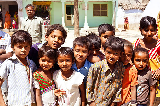 Sabbalpura, India - March 15, 2014: Group of happy indian children posing in the rural village, Rajasthan, India.