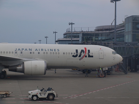Tokyo, Japan - July 28, 2013: JAL airlines plane sits at Haneda International (HND) airport waiting to load up passengers. Haneda Airport is one of the largest airlines in Japan.