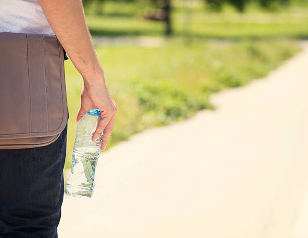 istock Bottle of water in hand 535554313