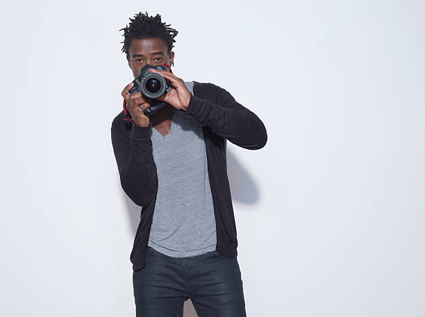 istock Male Photographer With Camera In Studio 535554491