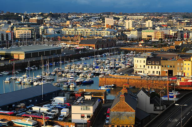 St.Helier, Jersey, U.K. Jersey, U.K. - February 3, 2015: The view of St.Helier harbour and under the same name, the capital of Jersey, viewed from Mount Bingham, on a sunny Winter's afternoon. channel islands england stock pictures, royalty-free photos & images