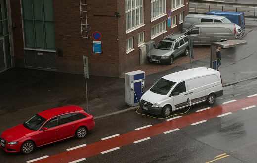 helsinki, finland - June 30, 2014: electrical van is in charge at street of helsinki finland