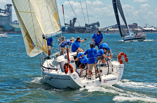 Newcastle,Australia - January 24,2015: Members of a local sailing club race their boats on the harbour. Newcastle is the 2nd city of New South Wales, after Sydney.