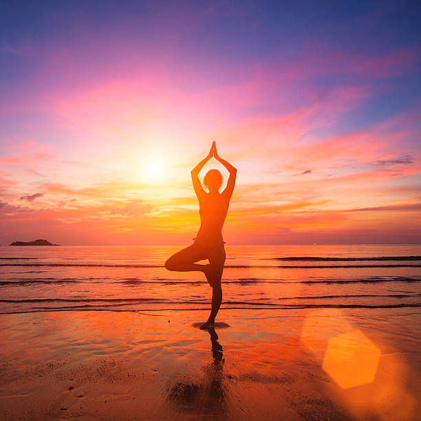 istock Silhouette of a young woman practicing yoga 535557287