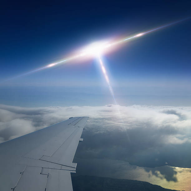 Ufo flies near airplane stock photo