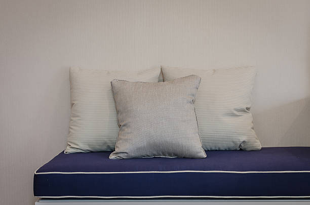 istock three pillows on blue sofa in living room 535557977