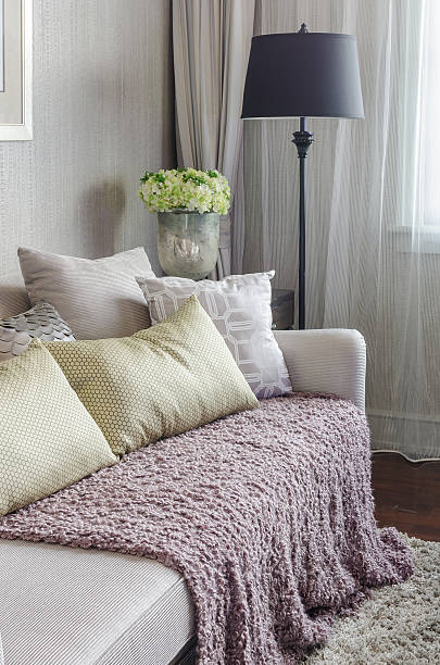 istock luxury sofa with pillows and black lamp in living room 535558165