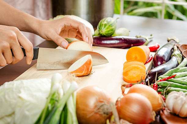 istock woman cutting vegetables 535559523