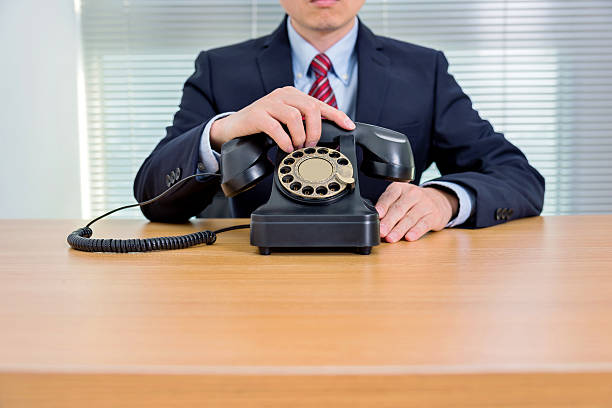 istock Businessman with old telephone 535561067