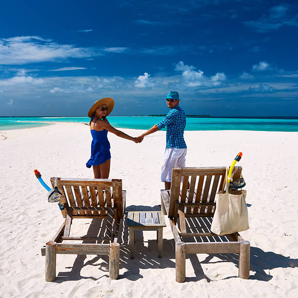 istock Couple in blue on a beach at Maldives 535565181