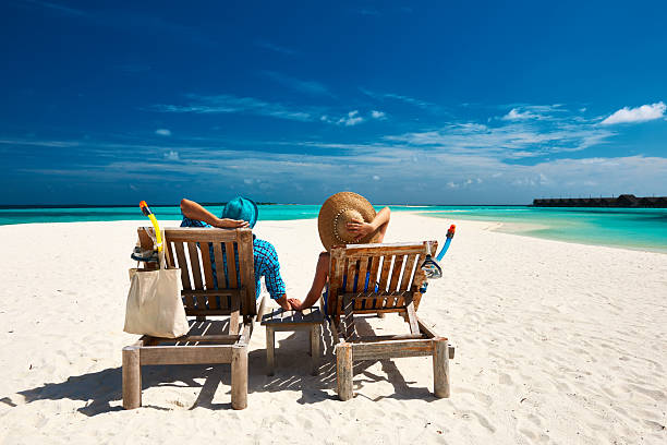 istock Couple relax on a beach at Maldives 535565275