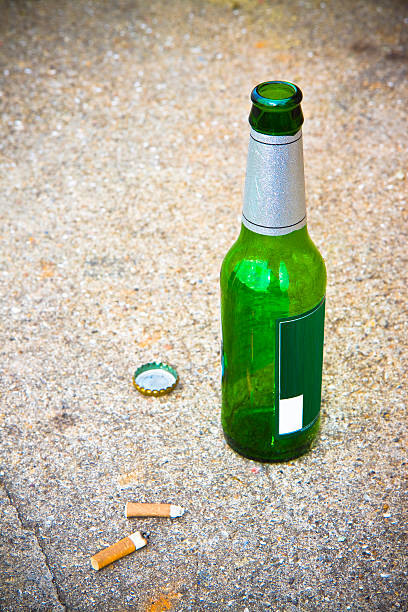 istock Bottle of beer resting on the ground 535569159