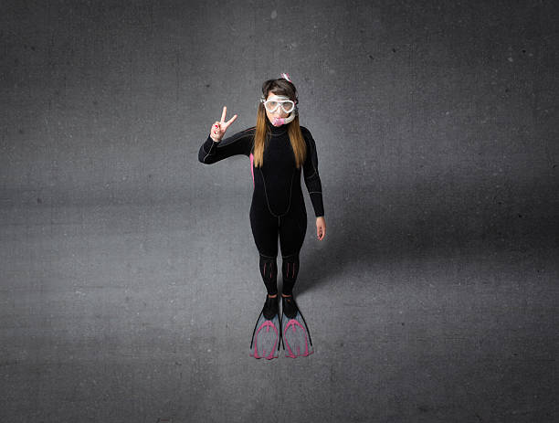 istock diver in a gray room gestures success 535570065