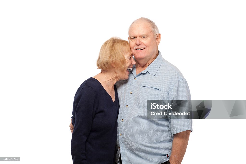 Happy senior couple against white Portrait of happy senior couple embracing against white background Adult Stock Photo