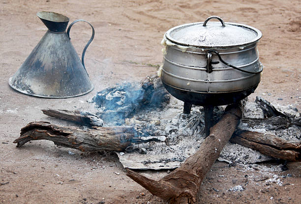 istock Cooking corn cereal in contrule on fire in the village, 535570923