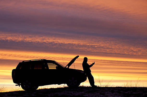 istock Man With Car Trouble Texting For Roadside Assistance 535571399
