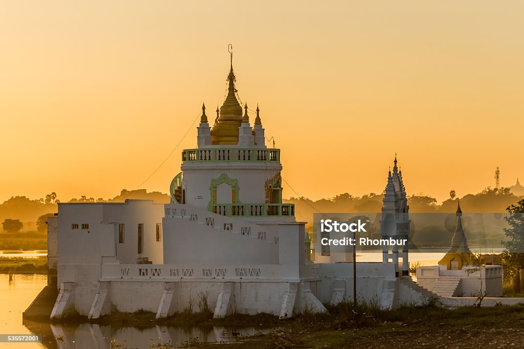 Shwe Modeptaw Pagoda Shwe Modeptaw Pagoda as seen from the famous U Bein Bridge in Amarapura at sunset 2015 Stock Photo