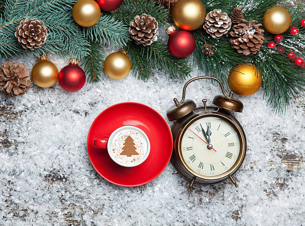 istock Cappuccino with christmas tree shape and clock on artificial sno 535572103