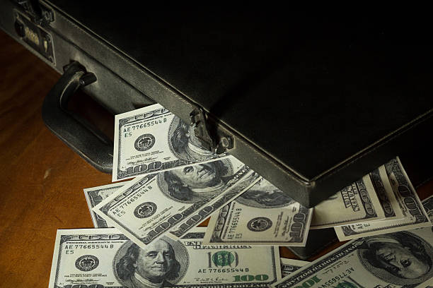 istock Still life dollars bill with suitcase. 535572135