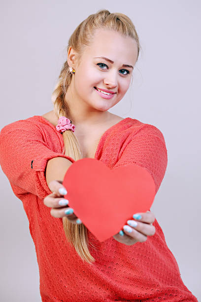 istock woman holding a heart 535572801