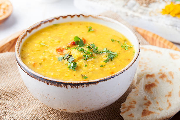 istock Lentil soup with pita bread in ceramic white bowl 535579556