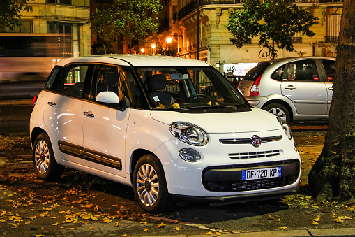 Paris, France - August 8, 2014: Motor car Fiat 500L is parked in the city street.