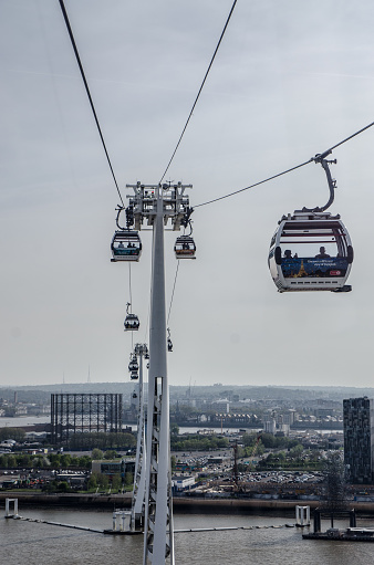 London, England - May 5, 2016: Aerial view of Emirates Greenwich peninsula cable car during day in springtime