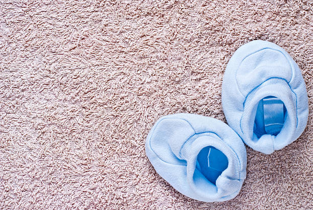 istock Pair of blue baby booties 535594890