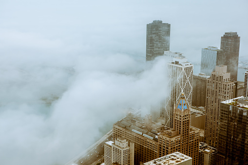 Cold and cloudy day in Chicago, Illinois photographed from the top floor of the John Hancock Center.