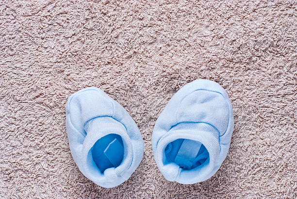 istock Two cute blue baby shoes 535598162