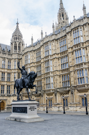 Statue of King Richard Coeur de Lion besides Westminster Abbey   during day in springtime