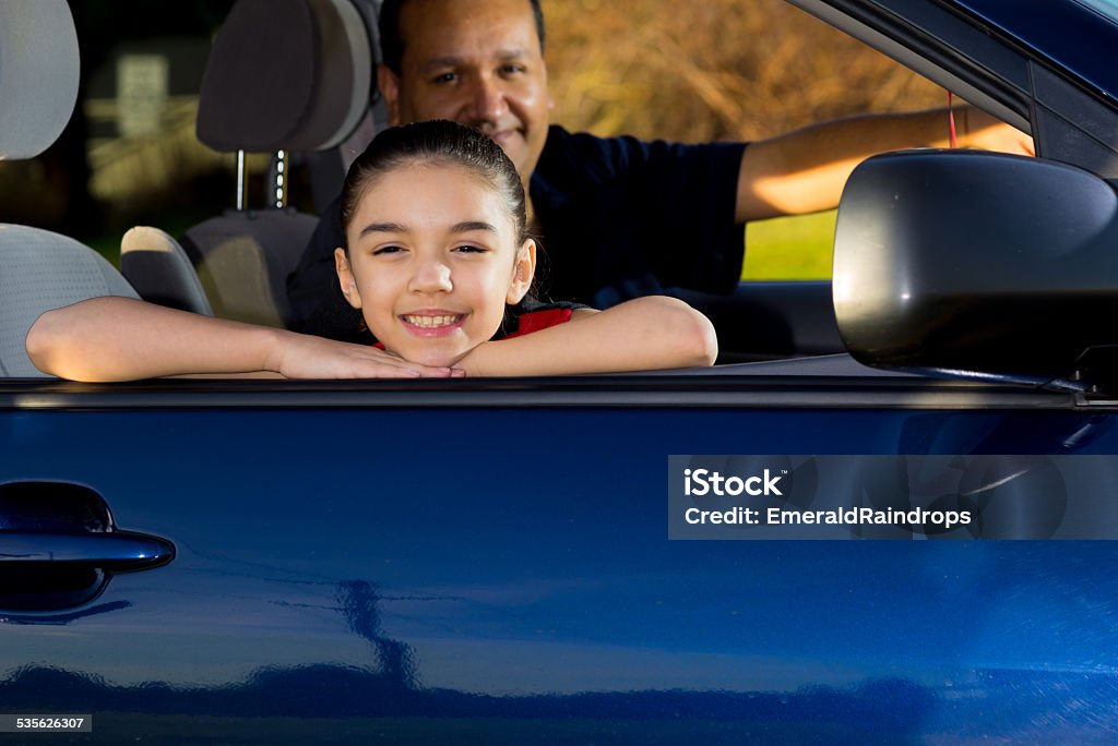Dad Gets Ready To Drive Daughter To Practice Hispanic Dad Gets Ready To Drive Daughter To Practice Family Stock Photo