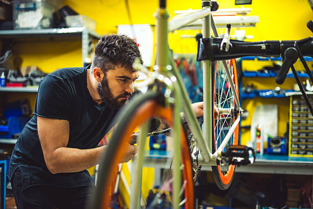 istock Bike mechanic in his workshop 535626450