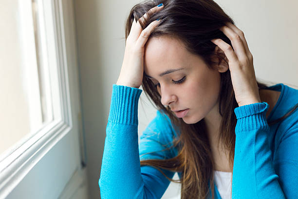 istock Depressed young woman sitting at home. 535626509