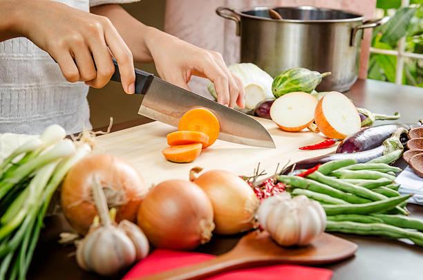 istock woman cutting vegetables 535626815