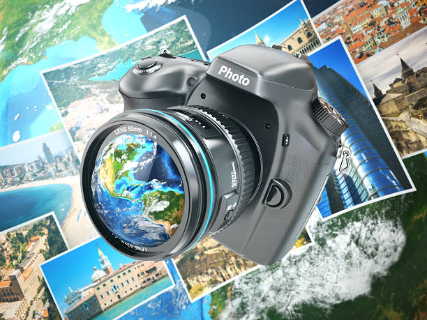 istock Digital photo camera on background from earth and photographs. 535627055