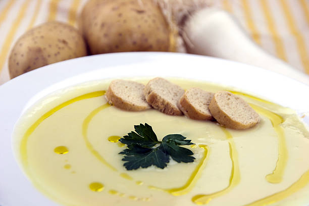 Italian potato and leek soup with olive oil, parsley and croutons
