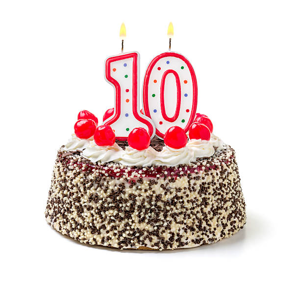 istock Birthday cake with burning candle number 10 535627467