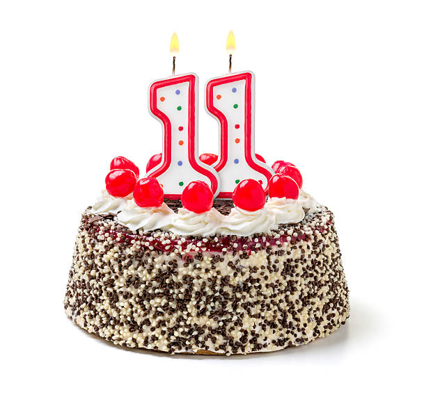 istock Birthday cake with burning candle number 11 535627469