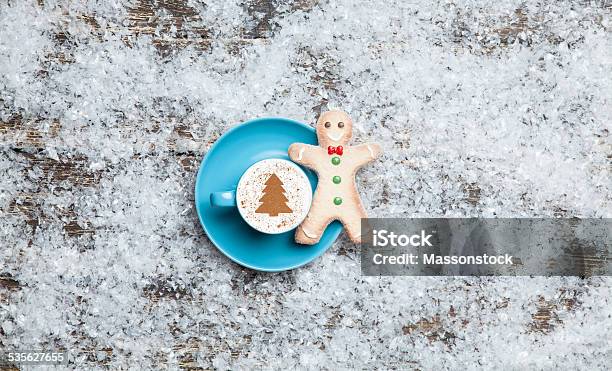 Cappuccino With Christmas Tree Shape And Gingerbread Man On Arti Stock Photo - Download Image Now